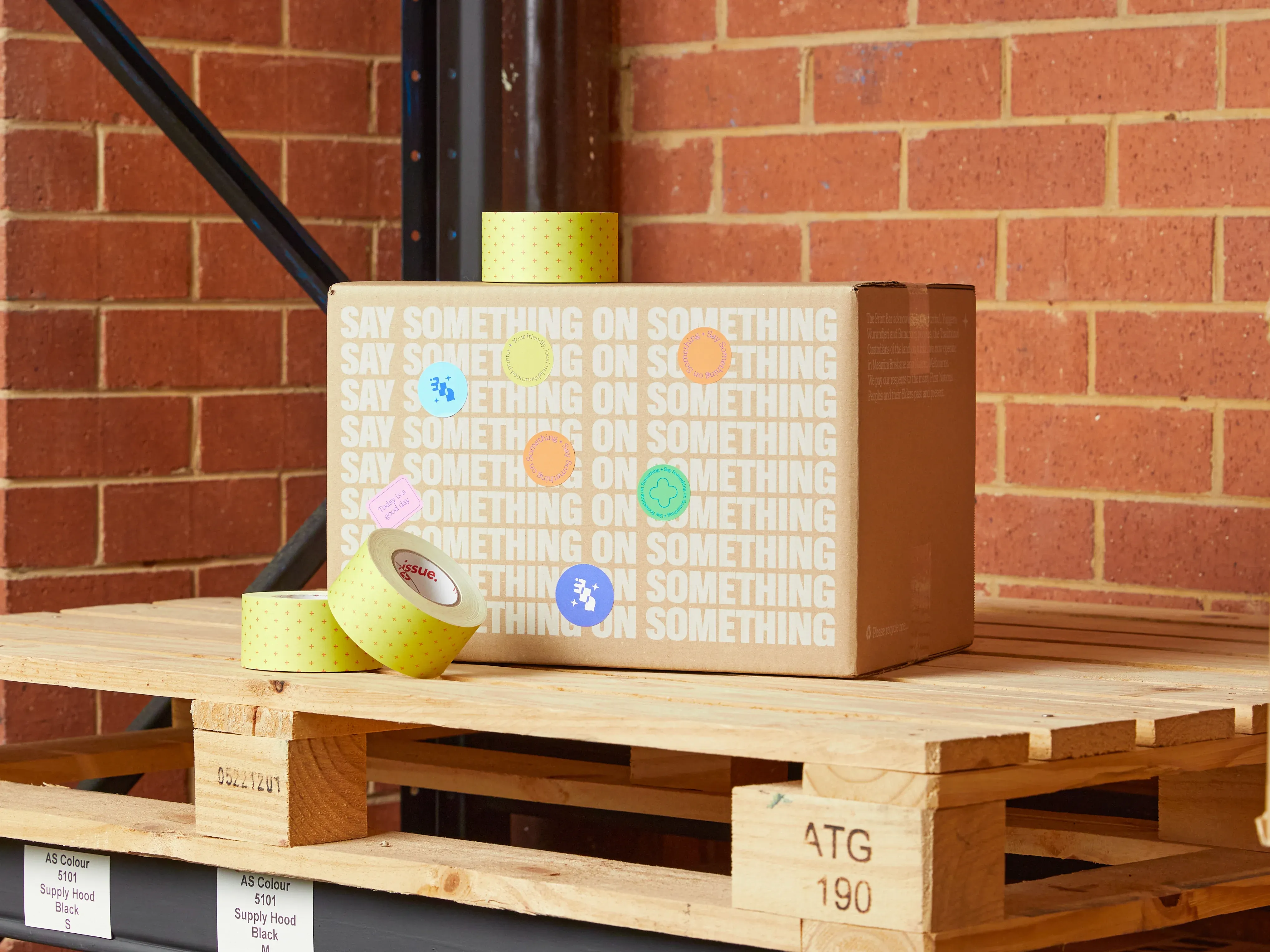 A Print Bar sustainable packaging box sits on a shipping crate ready to be delivered Australia wide or internationally
