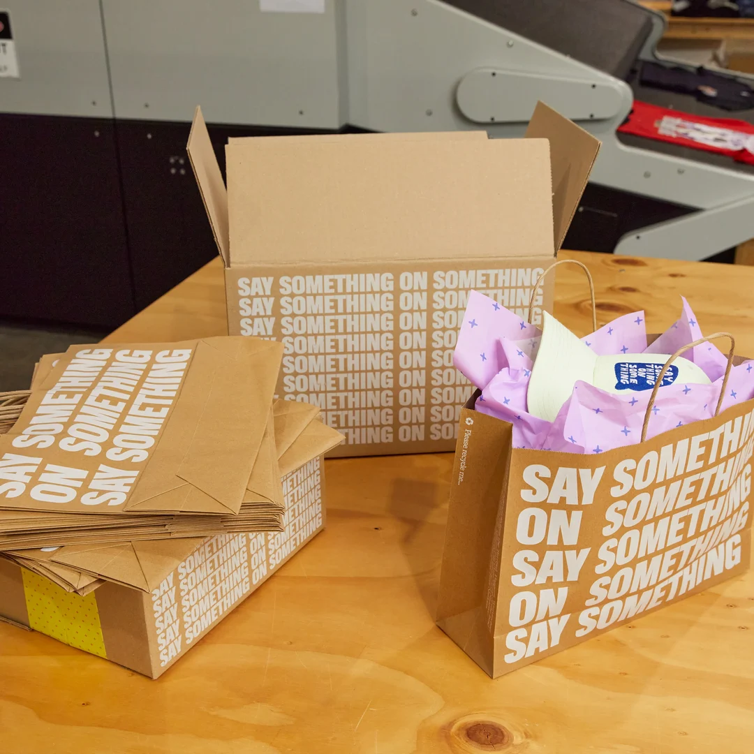 One a table sits The Print Bar's sustainable packaging that is shipped Australia wide and internationally