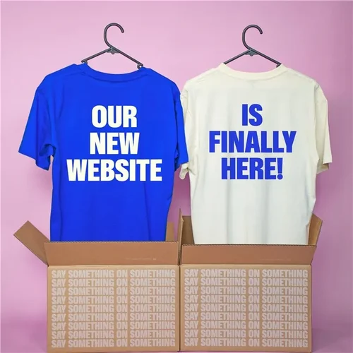 White t-shirt with text that says "Welcome to our new website"