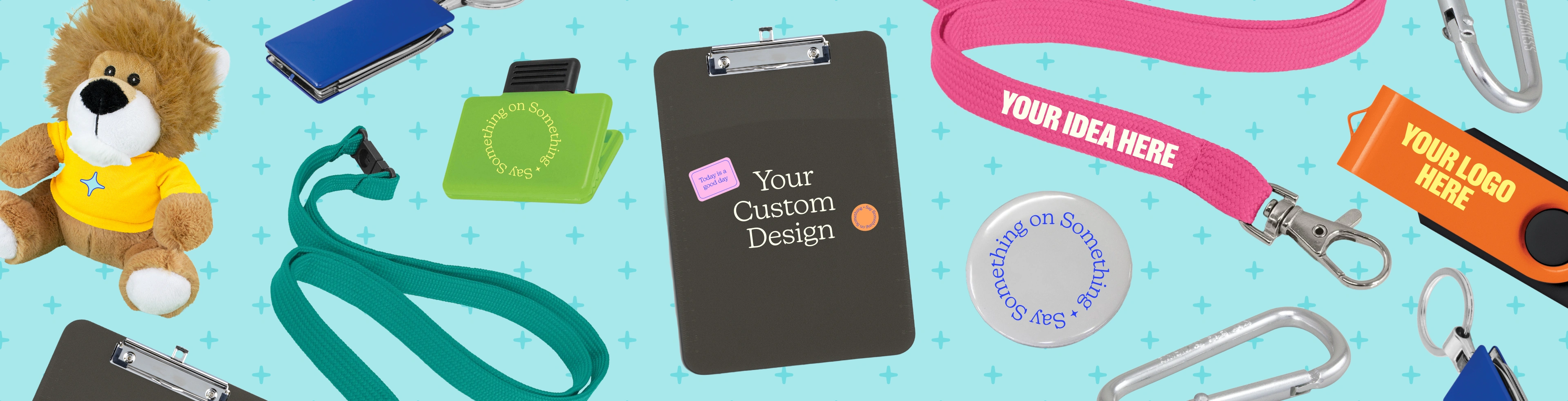 Image with custom lanyards, clipboards and event merchandise that have the text "design your own" on them
